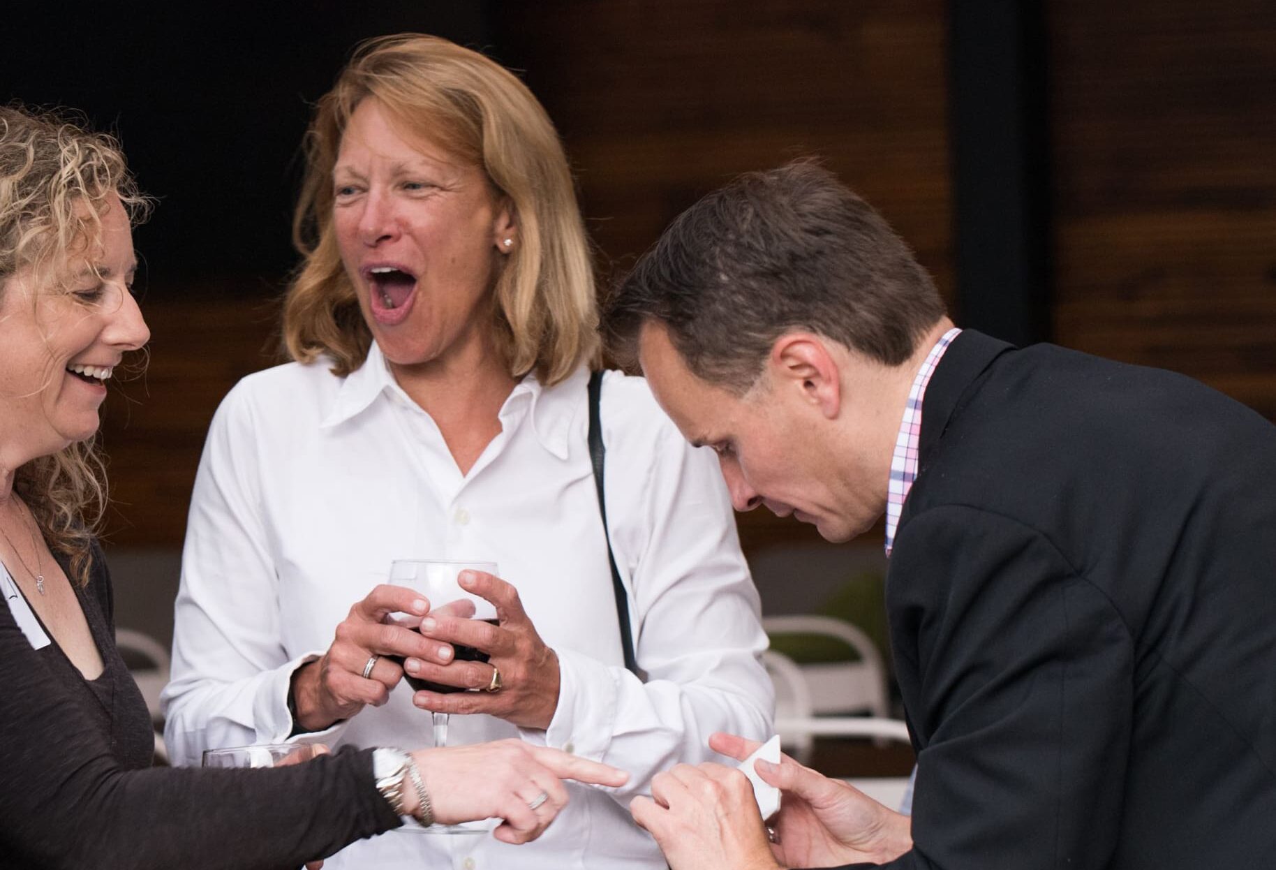 Guests reacting to magic trick